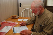 Man filling out Census form